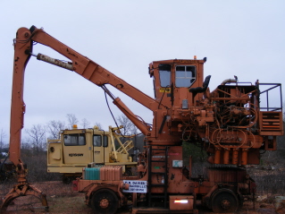 Kershaw 12-9. 4000lb lift off side very effective for ties, rail, and storm pick up. Also has clam bucket for ditching.