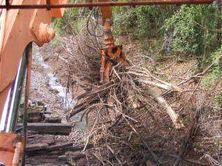 12-9 Bundle loader removing drain blockage in one grab.
